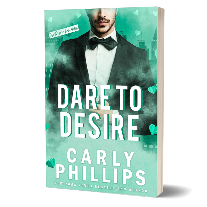Dare to Desire paperback cover, green background with a handsome young man wearing a tuxedo, white jacket and bow tie.