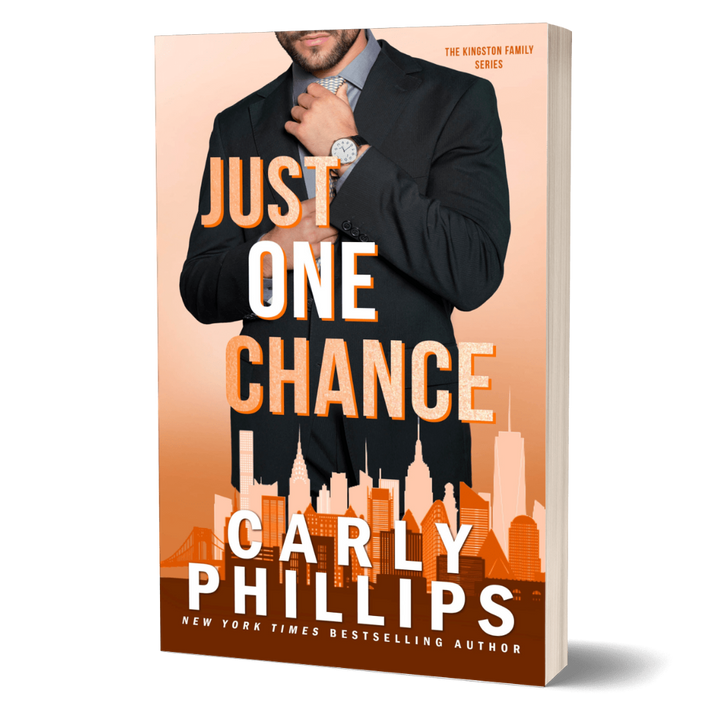 Book cover of 'Just One Chance' by Carly Phillips with a man adjusting his tie against an orange cityscape background.