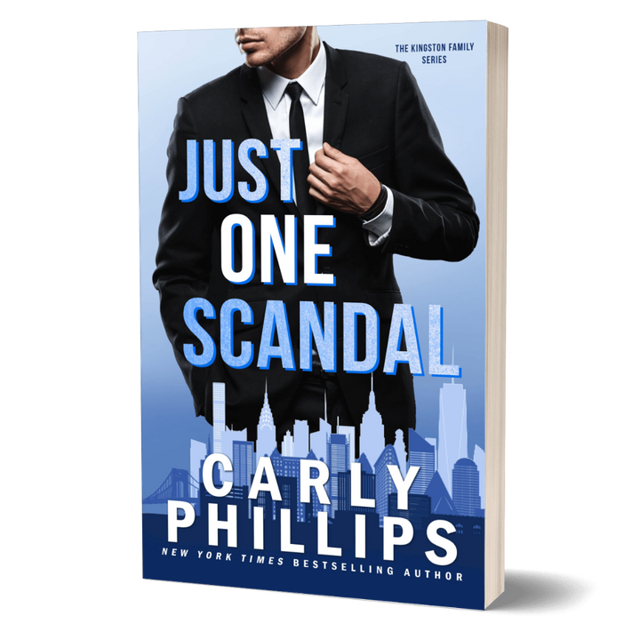 Book cover of 'Just One Scandal' by Carly Phillips with a man in a suit against a city skyline.